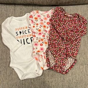 Set of three 6 month long-sleeved onesies!